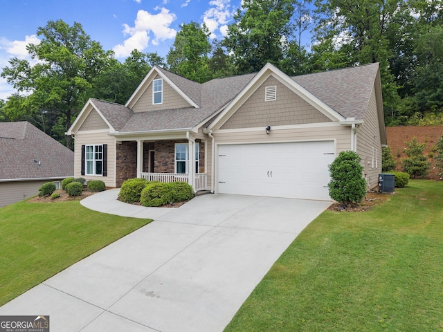 3521 Phoenix Cove Dr, Gainesville, GA 30506 - craftsman house featuring covered porch, a garage, driveway, and a front yard