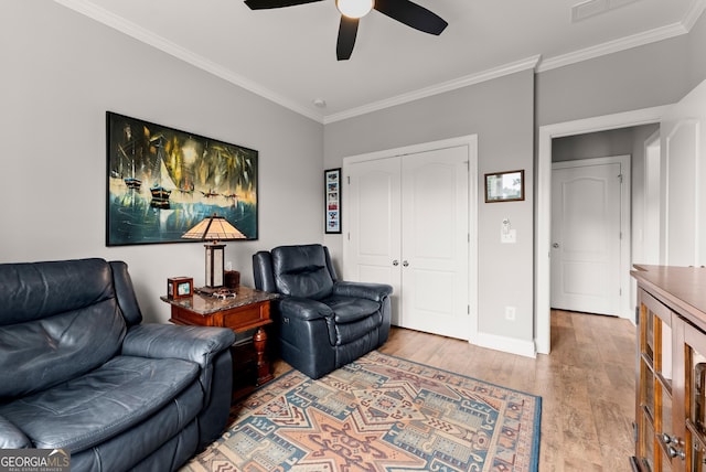 3521 Phoenix Cove Dr, Gainesville, GA 30506 - living room featuring ornamental molding, a ceiling fan, light wood-style floors, and baseboards