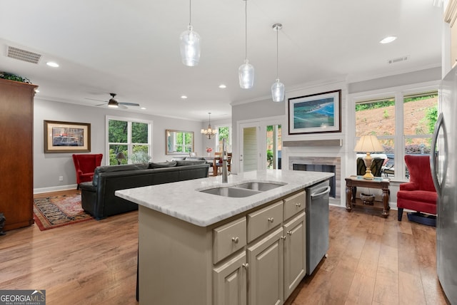 3521 Phoenix Cove Dr, Gainesville, GA 30506 - kitchen with a sink, open floor plan, ornamental molding, stainless steel appliances, and a fireplace
