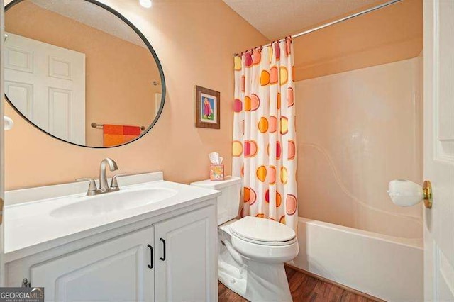 2004 Spicers Ln, Woodstock, GA 30189 - bathroom featuring vanity, wood finished floors, toilet, and shower / bath combo with shower curtain
