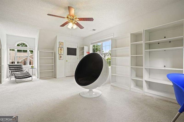 2004 Spicers Ln, Woodstock, GA 30189 - sitting room with a textured ceiling, ceiling fan, and carpet flooring