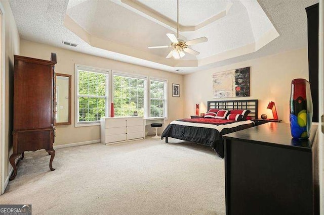 2004 Spicers Ln, Woodstock, GA 30189 - bedroom featuring a raised ceiling, carpet, baseboards, a ceiling fan, and a textured ceiling