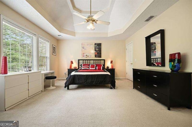 2004 Spicers Ln, Woodstock, GA 30189 - bedroom featuring a raised ceiling, light colored carpet, baseboards, and a ceiling fan