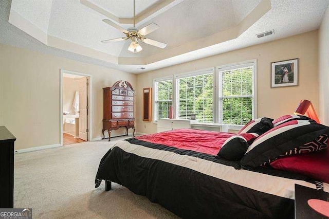 2004 Spicers Ln, Woodstock, GA 30189 - bedroom with a raised ceiling, baseboards, carpet, connected bathroom, and a textured ceiling