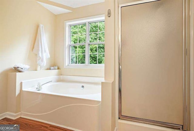2004 Spicers Ln, Woodstock, GA 30189 - full bath with a shower stall, a garden tub, and wood finished floors