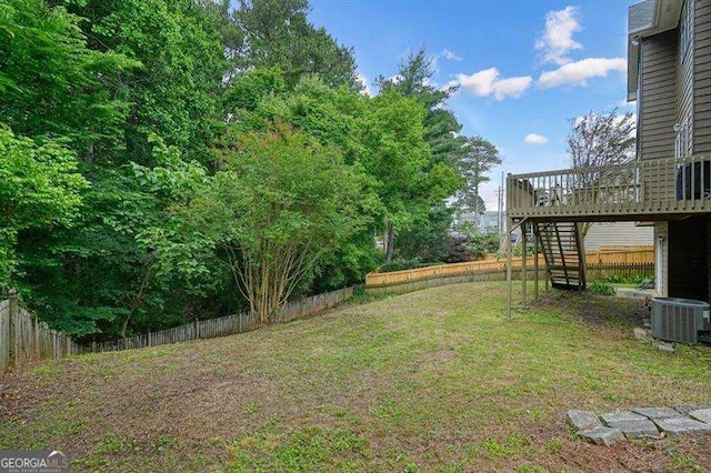 2004 Spicers Ln, Woodstock, GA 30189 - view of yard featuring stairs, a wooden deck, and central air condition unit
