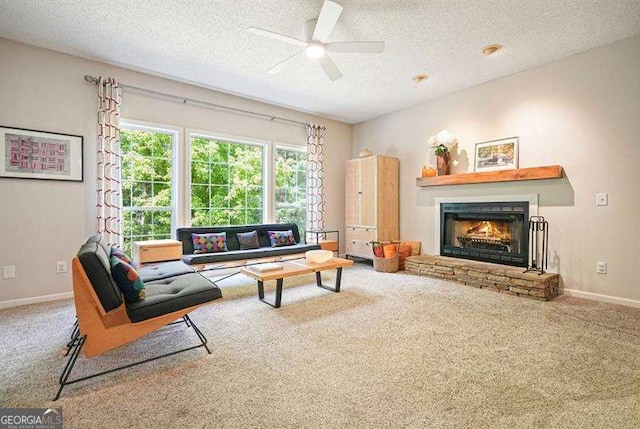 2004 Spicers Ln, Woodstock, GA 30189 - living area with carpet floors, a fireplace, a textured ceiling, a ceiling fan, and baseboards