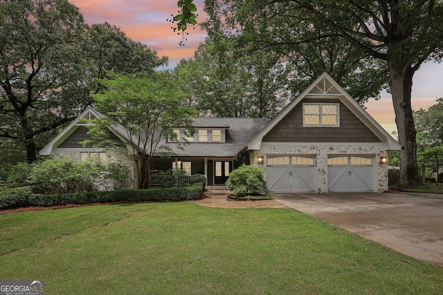 3612 Bill Gardner Pkwy, Locust Grove, GA 30248 - craftsman-style home featuring a lawn, stone siding, concrete driveway, a porch, and a garage