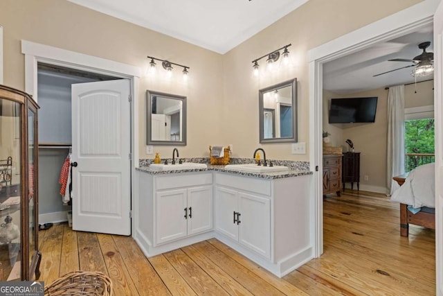 6224 Eagle Ct, Gainesville, GA 30506 - ensuite bathroom featuring double vanity, hardwood / wood-style floors, and ceiling fan
