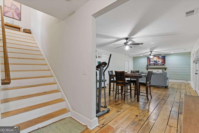 6224 Eagle Ct, Gainesville, GA 30506 - dining room featuring a ceiling fan, hardwood / wood-style flooring, and stairway