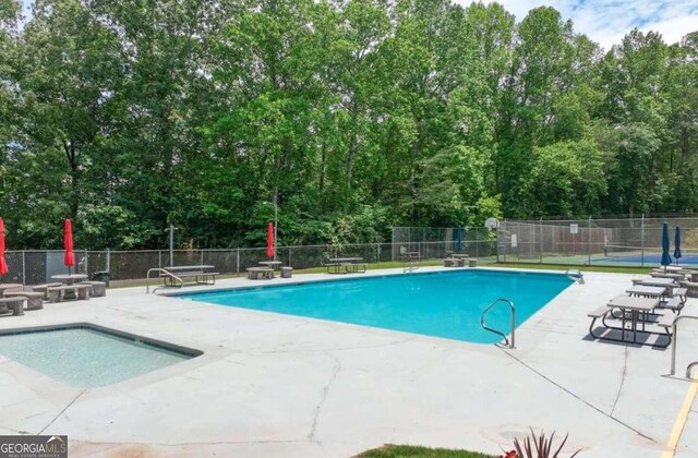 6224 Eagle Ct, Gainesville, GA 30506 - community pool with a patio area and view of scattered trees