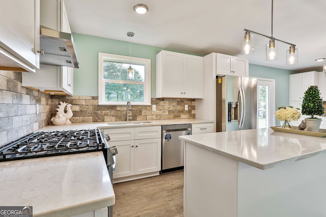 191 Pine St NE, Fairburn, GA 30213 - kitchen with appliances with stainless steel finishes, plenty of natural light, and white cabinetry