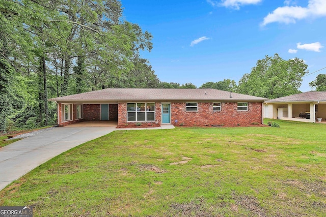 191 Pine St NE, Fairburn, GA 30213 - ranch-style house featuring driveway, brick siding, a front yard, and a carport