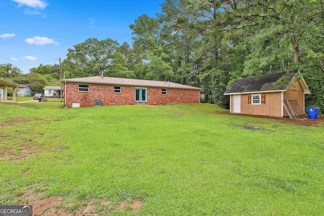 191 Pine St NE, Fairburn, GA 30213 - rear view of house featuring a yard, a storage unit, and brick siding