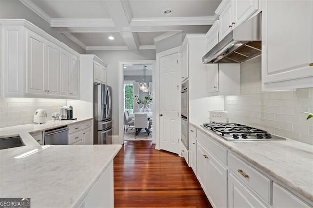 1070 Standard Dr NE, Brookhaven, GA 30319 - kitchen featuring appliances with stainless steel finishes, under cabinet range hood, white cabinets, recessed lighting, and beamed ceiling