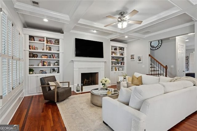 1070 Standard Dr NE, Brookhaven, GA 30319 - living area featuring dark wood-style flooring, a ceiling fan, coffered ceiling, beamed ceiling, and a fireplace with flush hearth