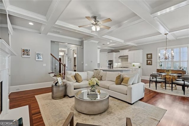 1070 Standard Dr NE, Brookhaven, GA 30319 - living room featuring coffered ceiling, dark wood finished floors, stairs, a ceiling fan, and a chandelier