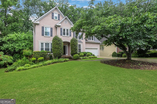 11280 Brookhollow Trl, Alpharetta, GA 30022 - view of front of house with a garage, a front lawn, stucco siding, and driveway