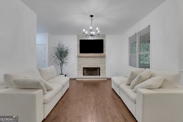 11280 Brookhollow Trl, Alpharetta, GA 30022 - living room with a chandelier, wood finished floors, and a stone fireplace