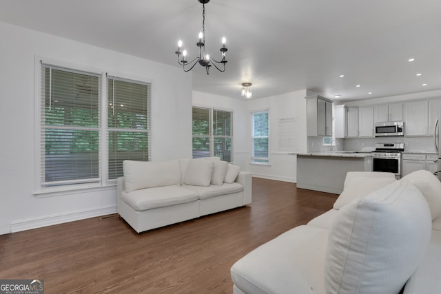 11280 Brookhollow Trl, Alpharetta, GA 30022 - living room with a chandelier, dark wood-style floors, and recessed lighting
