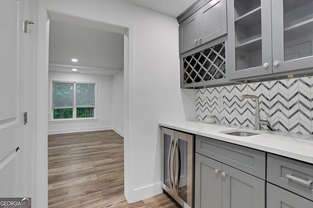 11280 Brookhollow Trl, Alpharetta, GA 30022 - indoor wet bar with light wood-style floors, tasteful backsplash, and recessed lighting