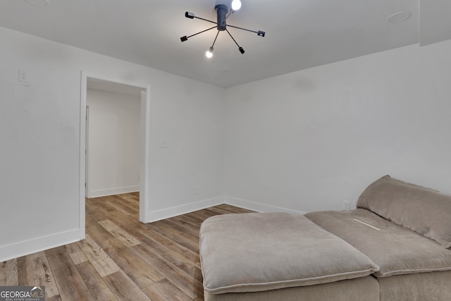 11280 Brookhollow Trl, Alpharetta, GA 30022 - sitting room featuring wood finished floors and a chandelier