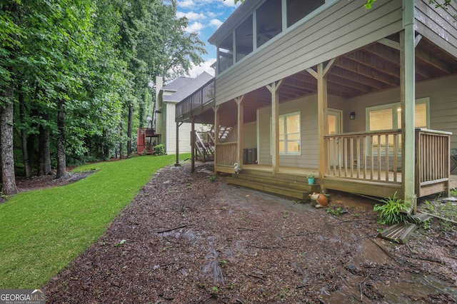 11280 Brookhollow Trl, Alpharetta, GA 30022 - view of side of property featuring a lawn, a sunroom, and a deck