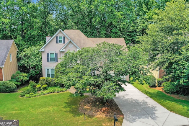 11280 Brookhollow Trl, Alpharetta, GA 30022 - view of front facade with a chimney, stucco siding, driveway, and a front lawn
