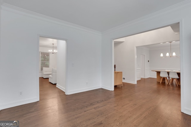 11280 Brookhollow Trl, Alpharetta, GA 30022 - unfurnished room with a chandelier, crown molding, and dark wood-type flooring