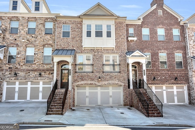 5910 Terrace Bend Way, Peachtree Corners, GA 30092 - townhome / multi-family property with driveway, an attached garage, and brick siding