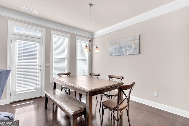 5910 Terrace Bend Way, Peachtree Corners, GA 30092 - dining area featuring a chandelier, dark wood finished floors, and ornamental molding