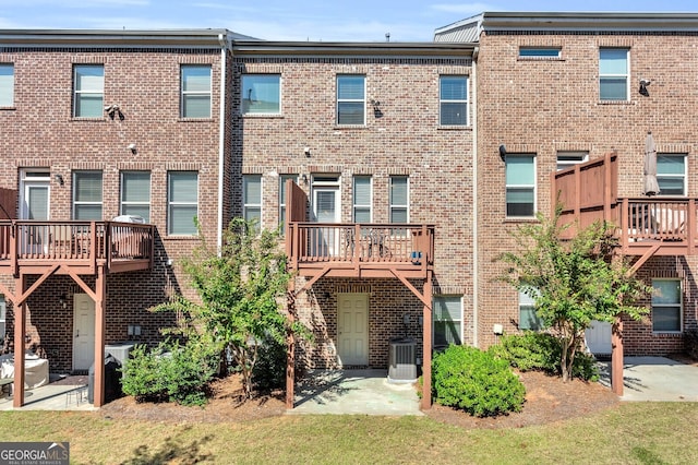 5910 Terrace Bend Way, Peachtree Corners, GA 30092 - back of house featuring brick siding and a patio area