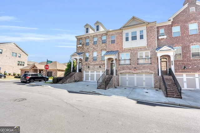 5910 Terrace Bend Way, Peachtree Corners, GA 30092 - view of property with stairs, brick siding, concrete driveway, and a garage