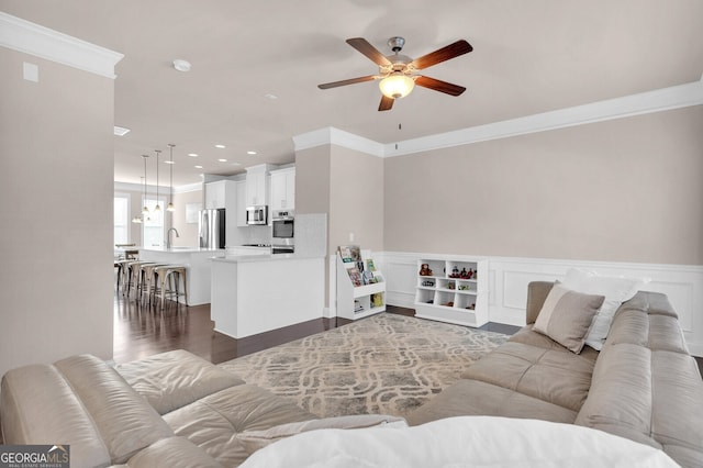 5910 Terrace Bend Way, Peachtree Corners, GA 30092 - living room featuring ceiling fan, crown molding, dark wood-style floors, wainscoting, and recessed lighting