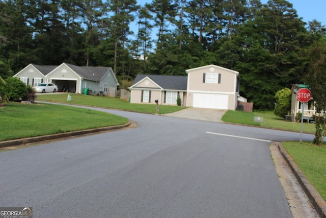 5574 Mccrossin Cir, Lithonia, GA 30038 - view of asphalt road featuring curbs and traffic signs