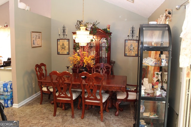 5574 Mccrossin Cir, Lithonia, GA 30038 - dining area with vaulted ceiling, a chandelier, and baseboards