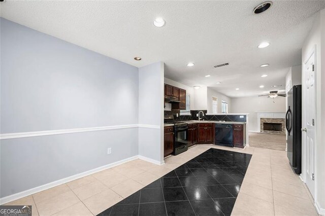 1486 Rogers Crossing Dr, Lithonia, GA 30058 - kitchen featuring black appliances, ceiling fan, light tile patterned floors, open floor plan, and tasteful backsplash