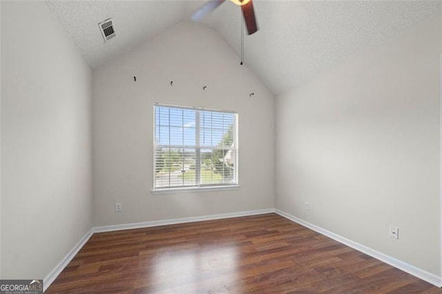 1486 Rogers Crossing Dr, Lithonia, GA 30058 - empty room featuring ceiling fan, wood finished floors, high vaulted ceiling, and a textured ceiling