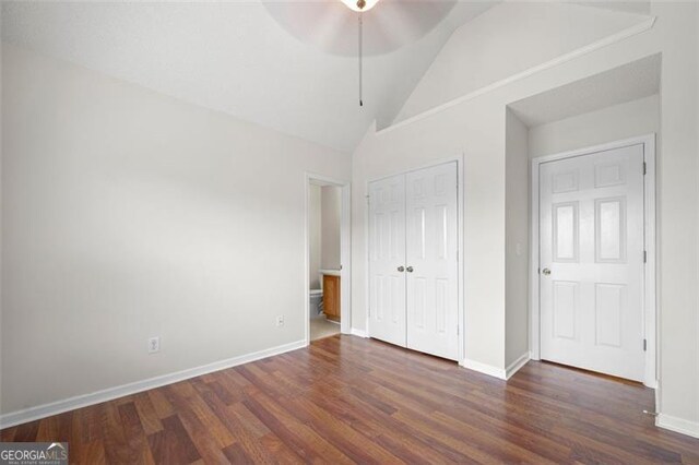 1486 Rogers Crossing Dr, Lithonia, GA 30058 - unfurnished bedroom featuring wood finished floors, lofted ceiling, a closet, and a ceiling fan