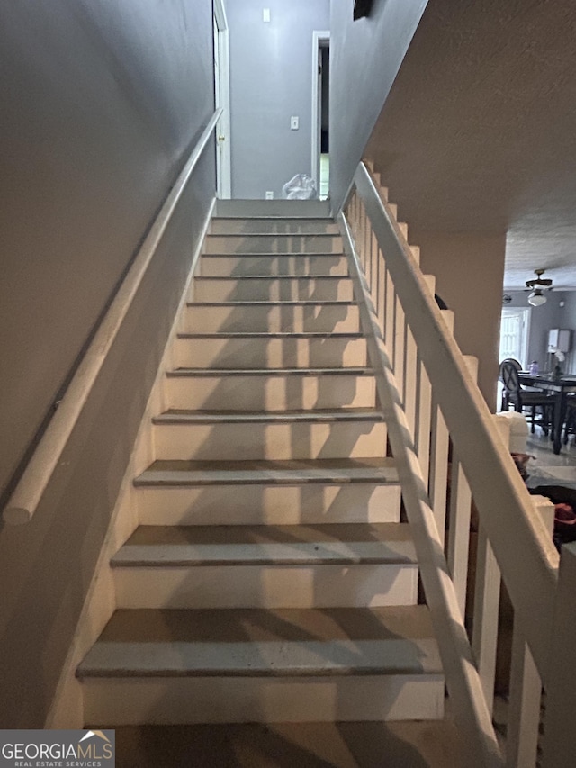 4514 Tifton Ct, Powder Springs, GA 30127 - stairs with a ceiling fan