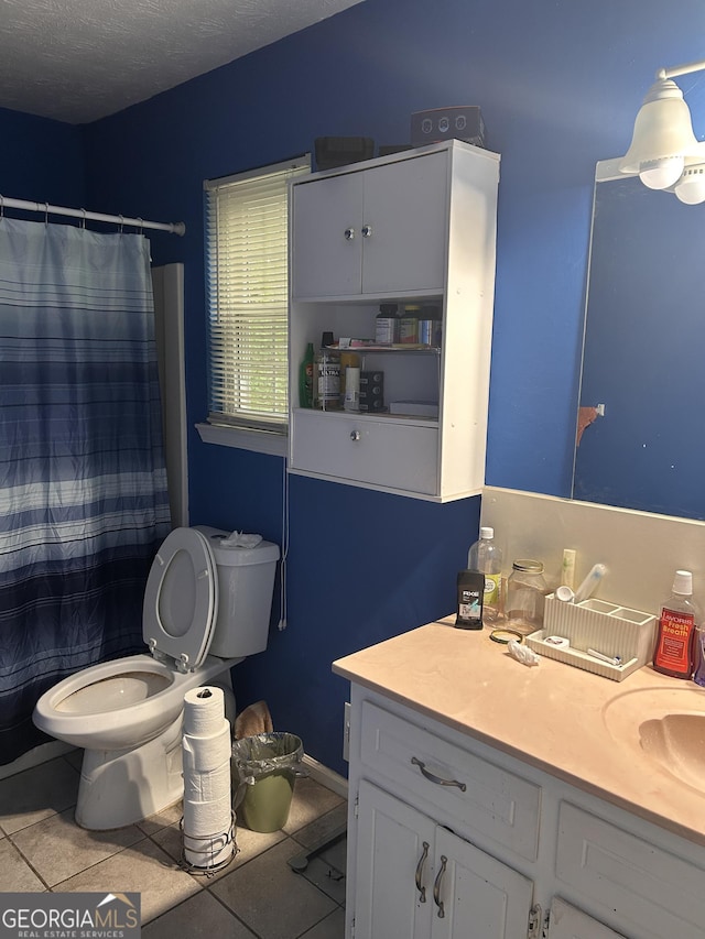 4514 Tifton Ct, Powder Springs, GA 30127 - bathroom with tile patterned floors, toilet, vanity, and a shower with shower curtain
