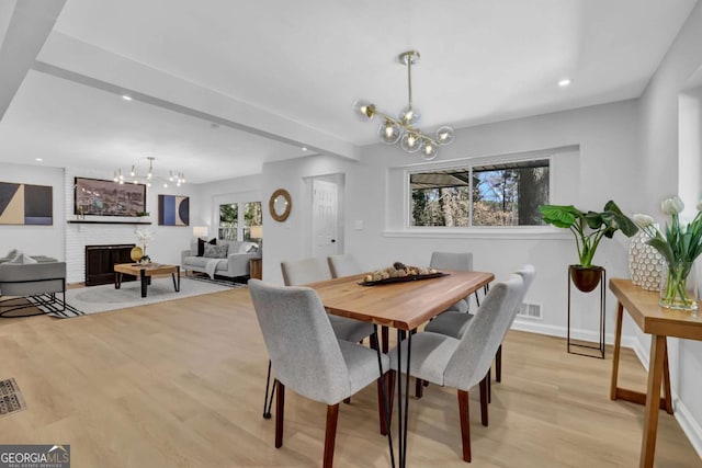 696 Kenilworth Cir, Stone Mountain, GA 30083 - dining area featuring a chandelier, light wood-style floors, baseboards, recessed lighting, and beamed ceiling