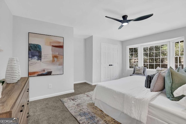 696 Kenilworth Cir, Stone Mountain, GA 30083 - carpeted bedroom featuring baseboards, ceiling fan, and a closet