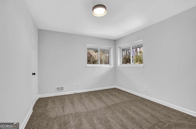 696 Kenilworth Cir, Stone Mountain, GA 30083 - empty room with carpet and baseboards