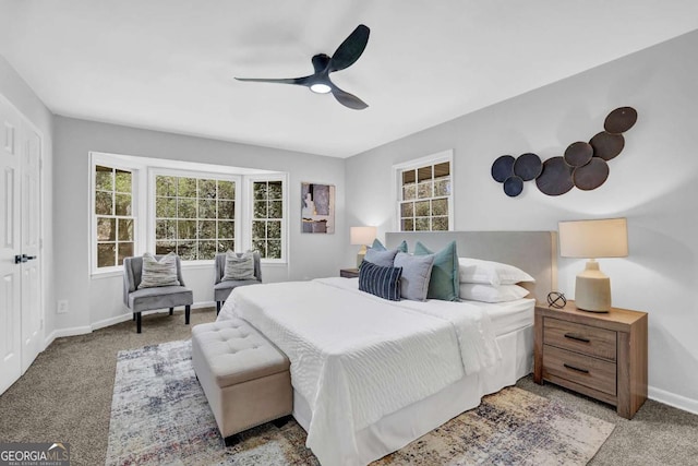 696 Kenilworth Cir, Stone Mountain, GA 30083 - carpeted bedroom featuring multiple windows, baseboards, and a ceiling fan