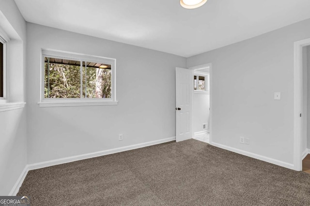 696 Kenilworth Cir, Stone Mountain, GA 30083 - unfurnished bedroom with carpet floors and baseboards