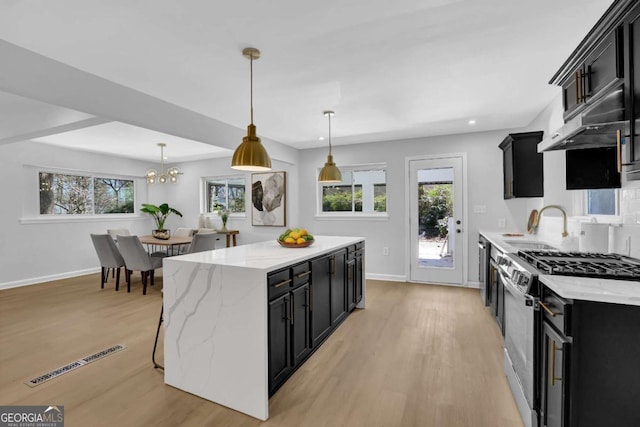 696 Kenilworth Cir, Stone Mountain, GA 30083 - kitchen featuring stainless steel range with gas cooktop, dark cabinets, baseboards, and recessed lighting