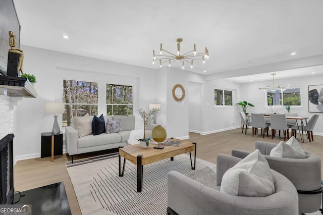 696 Kenilworth Cir, Stone Mountain, GA 30083 - living area with a chandelier, wood finished floors, recessed lighting, baseboards, and a fireplace