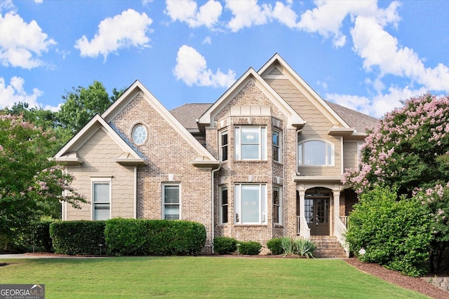 979 Pathview Ct, Dacula, GA 30019 - view of front of home with a front yard and brick siding