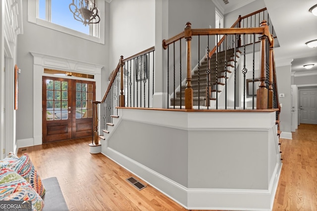 979 Pathview Ct, Dacula, GA 30019 - entryway with ornamental molding, healthy amount of natural light, wood finished floors, french doors, and stairway
